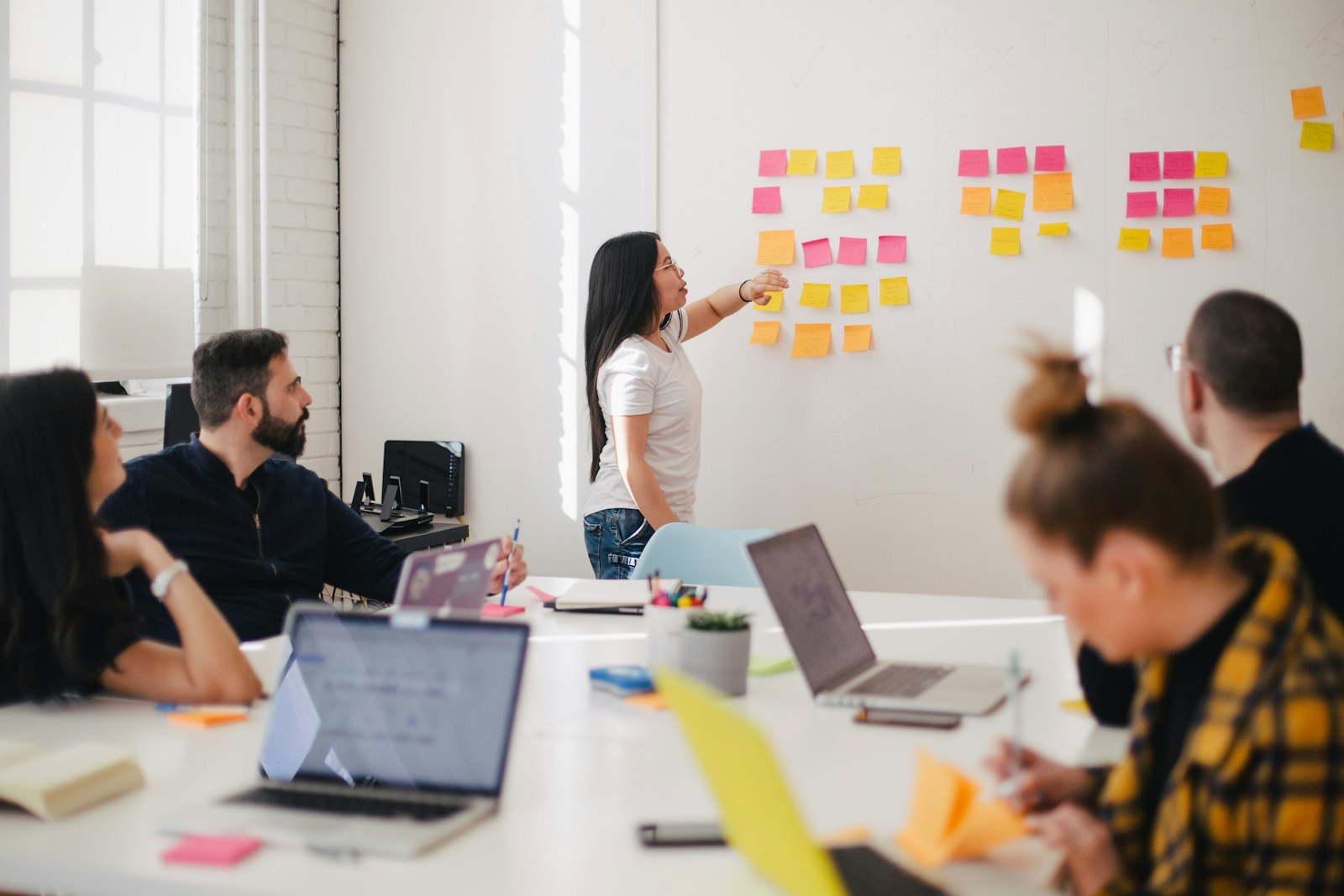 A small founding team working together in a bright studio